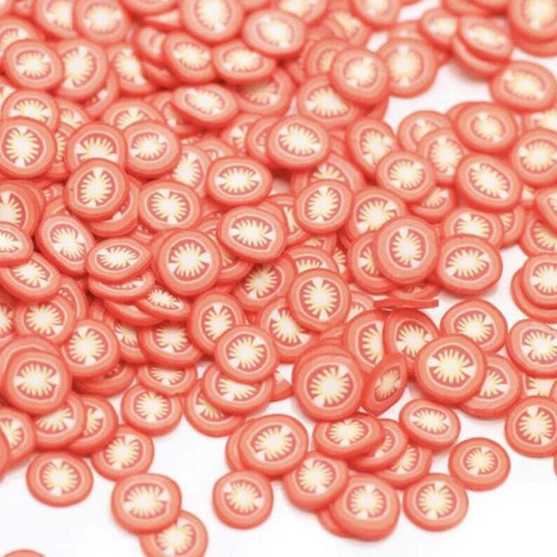 Bag of 1000 polymer clay fruit slices for nail art, 5mm diameter, mixed designs, ideal for DIY nail decoration projects.