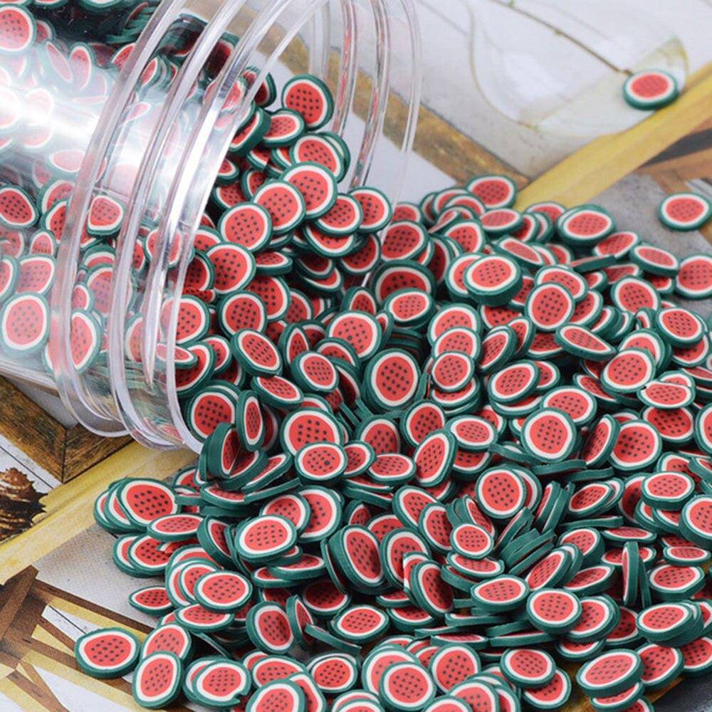 Assorted polymer clay fruit slices for nail art, 5mm diameter, 23 design types, in a bag for DIY nail decoration projects.