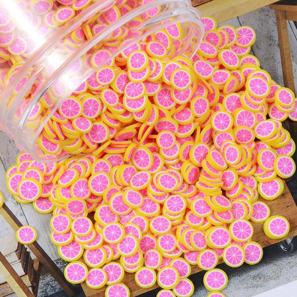 Set of 1000 polymer clay fruit slice nail art decorations in mixed 23 designs, 5mm diameter, for DIY nail art projects.