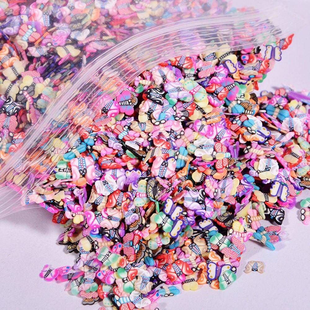 Set of 1000 polymer clay fruit slices for nail art, featuring 23 mixed designs, 5mm diameter, from dev2-aff.