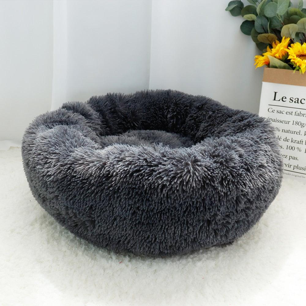 Brown fluffy Calming Dog Bed by dev2-aff, round plush donut shape with orthopedic support for dogs, cats, puppies, and pets.