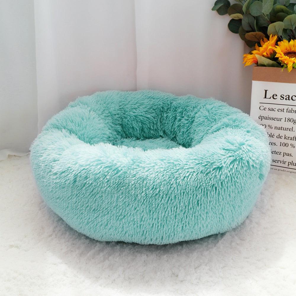 Brown fluffy donut dog bed with long plush fabric, round orthopedic lounger for dogs and cats, suitable for sleeping and resting.