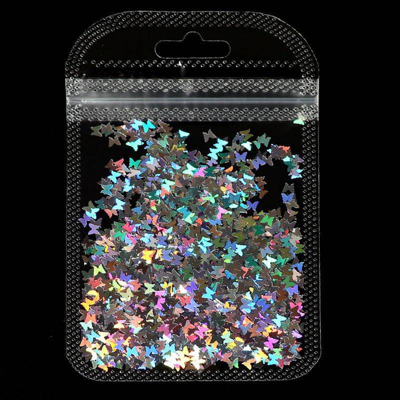 Holographic red butterfly nail art glitter sequins on a 3D laser sheet for nail design decoration by dev2-aff.