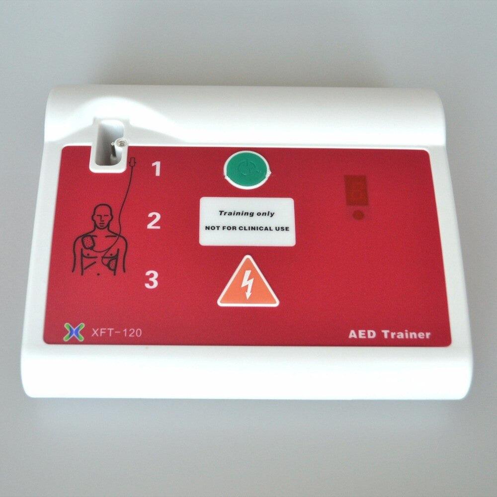 XFT-120C AED Simulator Trainer with electrode pads, bilingual English and Russian, used for CPR and first aid training.