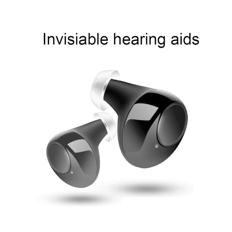 Pair of white USB rechargeable ITE hearing aids with skin tone color, designed for elderly users with hearing loss, discreet and invisible.