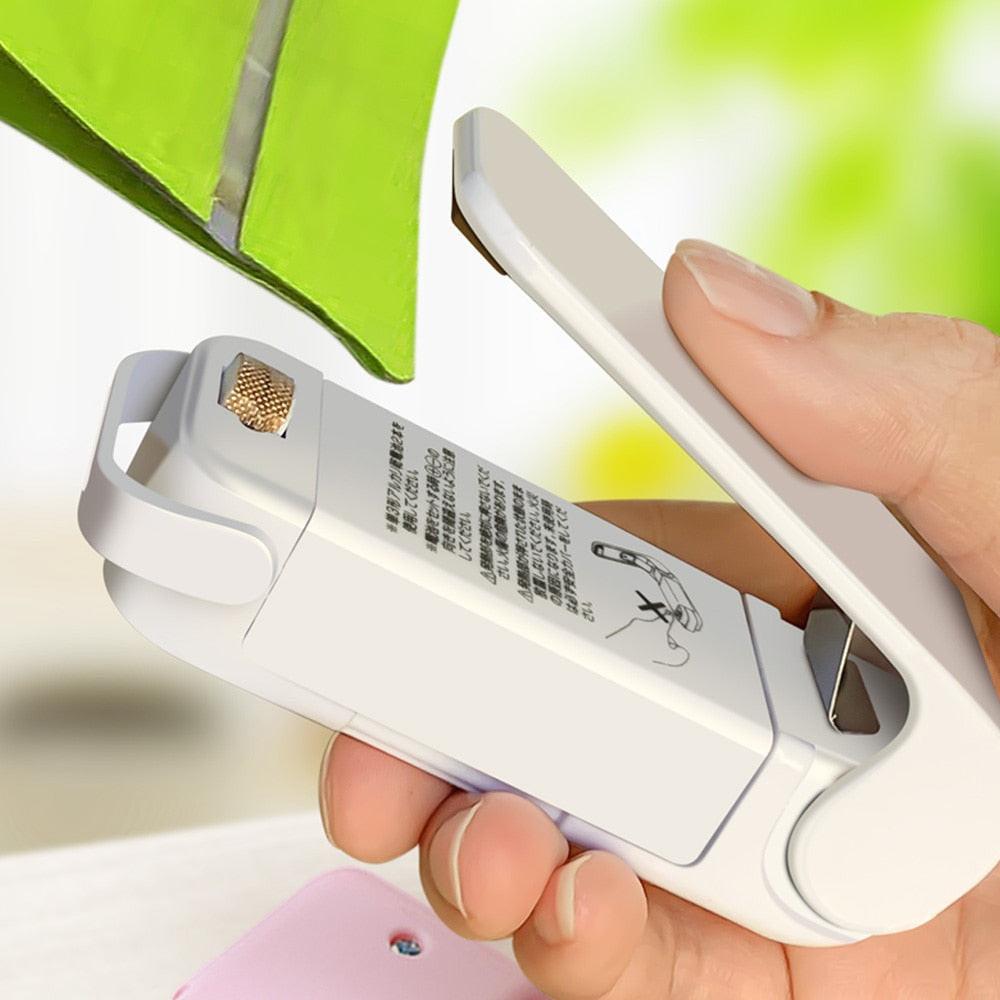 Dev2-aff mini heat bag sealing machine with portable thermal plastic food bag closures and sealing accessories.